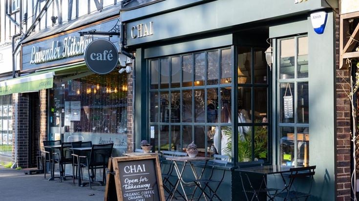a restaurant with tables and chairs outside