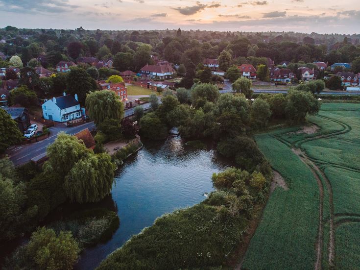 a river with a small town