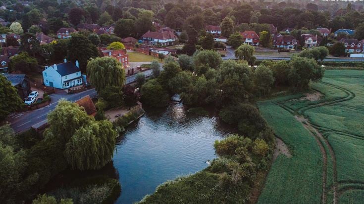 a river with a small town