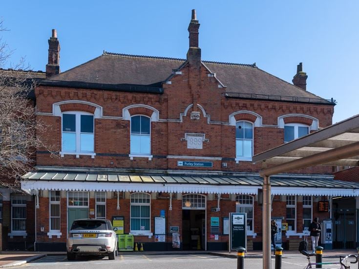 Red-brick exterior of Purley Station where people can catch trains to other towns and cities.