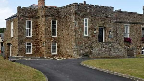 a stone building with a road