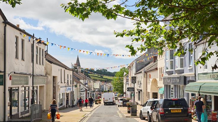 a street with cars and people on it