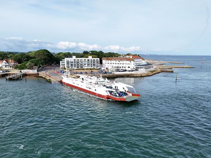 Aerial view of the Sandbanks Ferry crossing Poole Harbour between Sandbanks and Studland, Dorset.