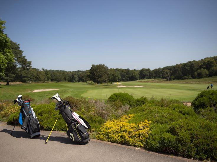 A golf course with a golf bag and golf clubs close to the market town of Wimborne, Dorset.