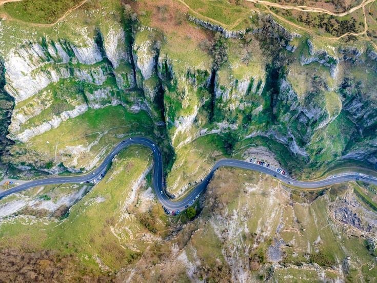 An aerial view of the road and cliffs through Cheddar Gorge in Somerset.