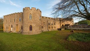 The exterior view of Taunton Castle on a sunny day.