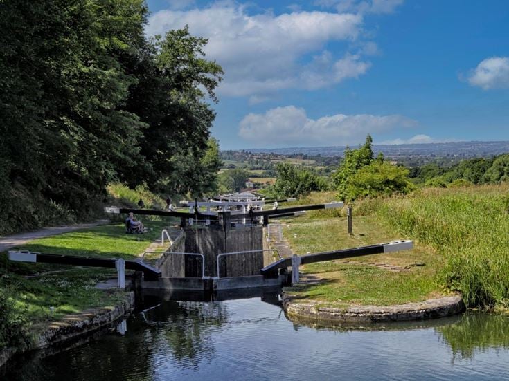 A view of the Caen Hill Locks from the top overlooking the Wiltshire countryside.