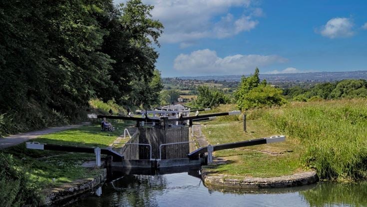 A view of the Caen Hill Locks from the top overlooking the Wiltshire countryside.