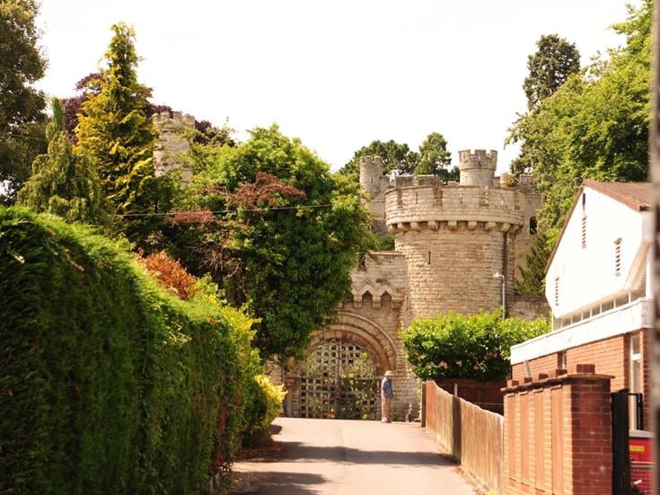 A view up a street towards Devizes Castle gatehouse.