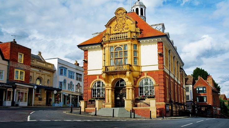 Marlborough Town Hall and historic buildings in the bustling town centre on a sunny day.