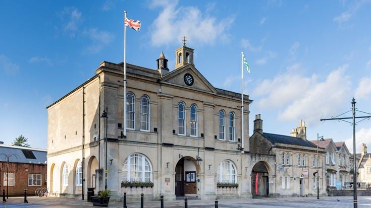 a large stone building with a flag on top