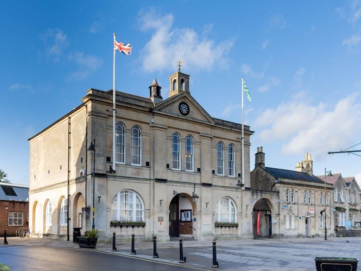 a large stone building with a flag on top
