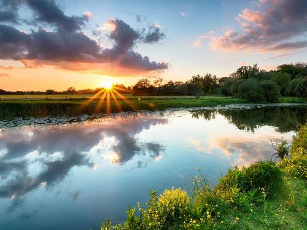 A sunset over the scenic River Stour in Wiltshire.