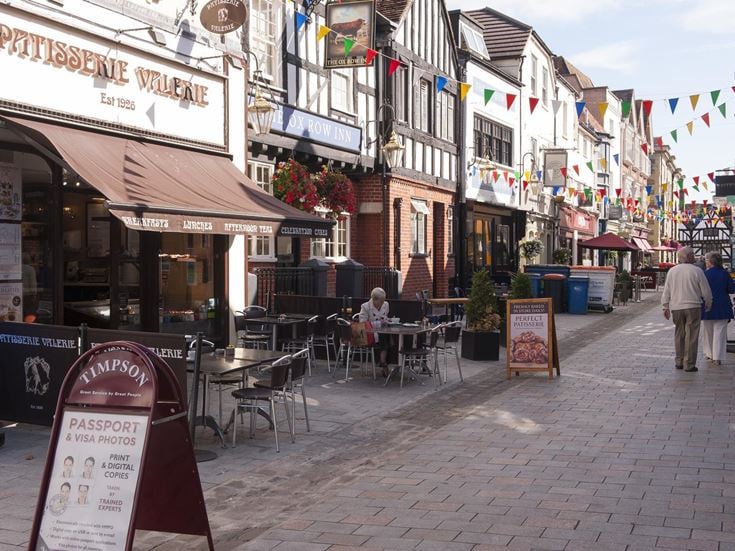 A bustling street in Salisbury centre with cafes, shops and restaurants.