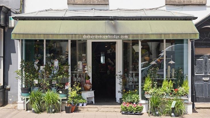 a building with plants in the front