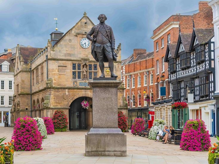 The statue of Robert Clive in The Square, in front of the Old Market Hall, in Shrewsbury.