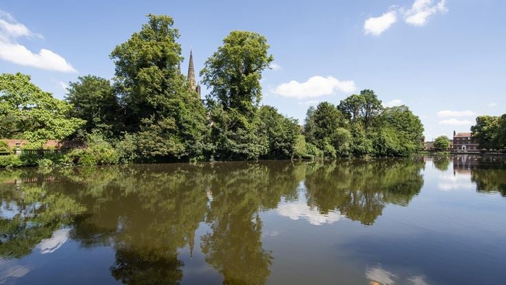 A lake with trees around it.