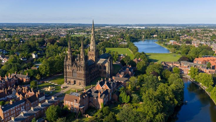 An aerial view of Lichfield Cathedral and surrounding town and countryside.