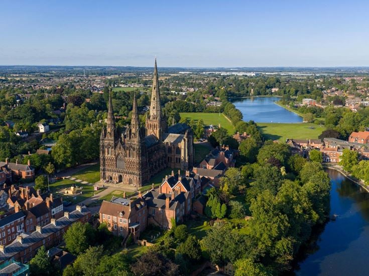 An aerial view of Lichfield Cathedral and surrounding town and countryside.