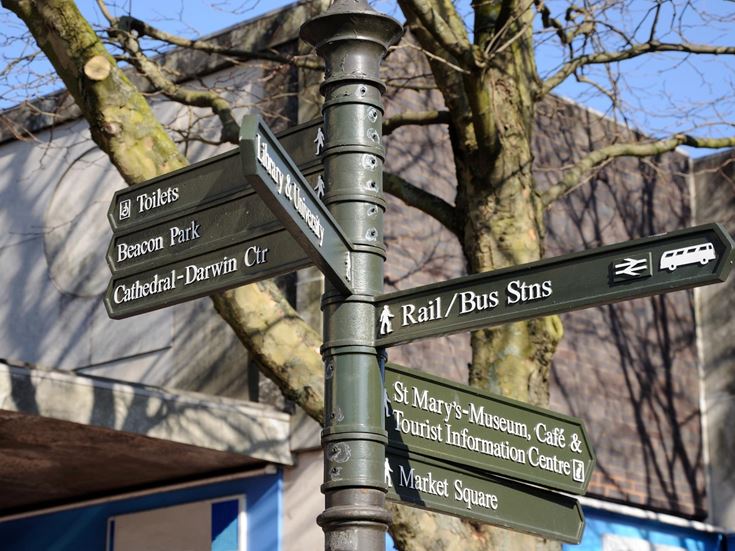 A signpost in Lichfield directing to several attractions and amenities.
