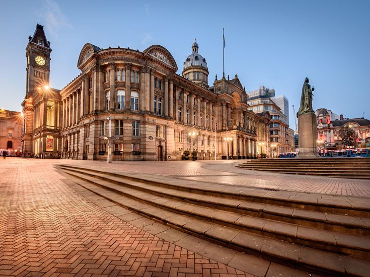 An exterior view of Birmingham Council House at dusk.