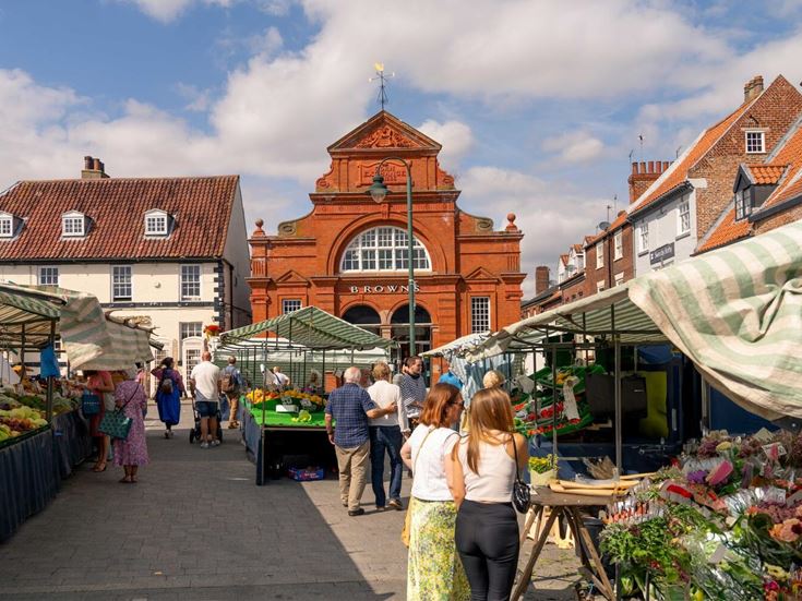 People enjoying a local street market in Beverley.