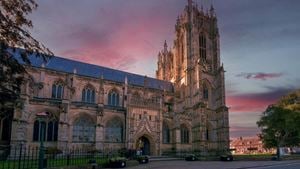The beautiful stone exterior of Beverley Minster during a sunset.