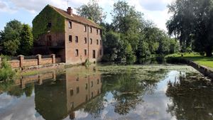 a brick building next to canal