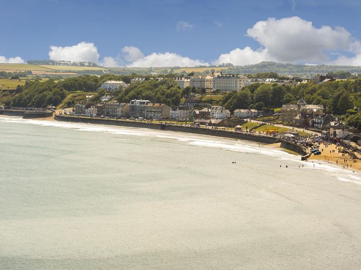 An aerial view of Filey town and beach on a sunny day.