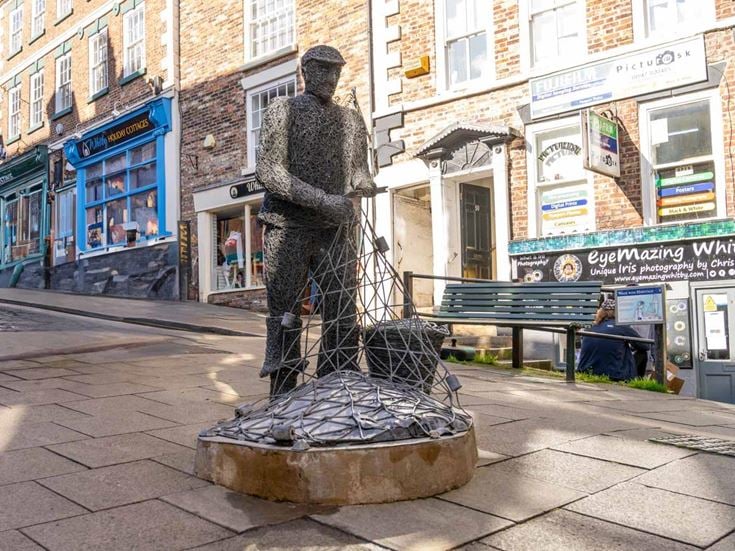 A statue of a fisherman in Whitby town centre