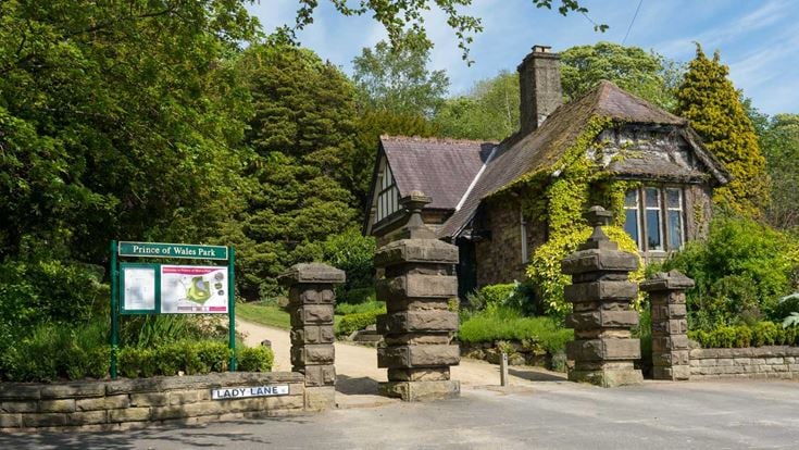 a stone building with a sign
