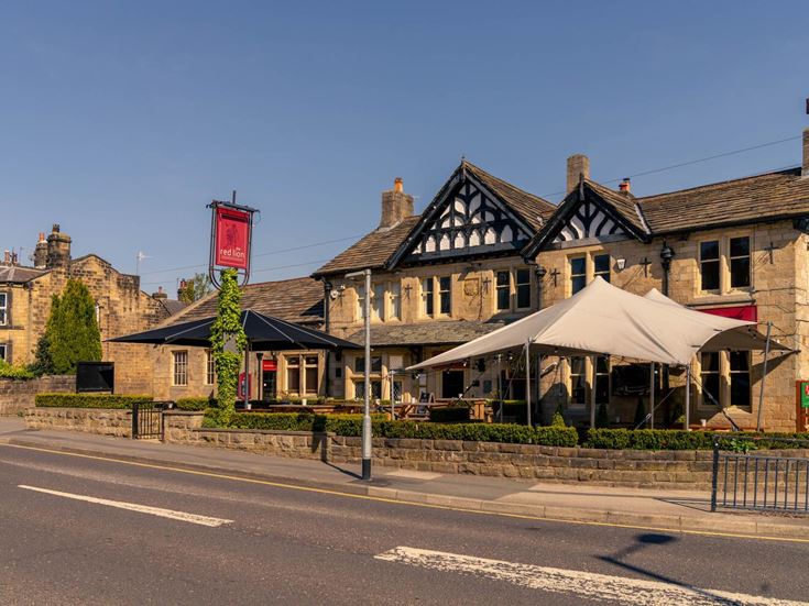 Pub next to a road in Burley in Wharfedalee