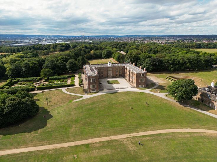 aerial photo of Temple Newsam house and it's grounds with Leeds city in the distance