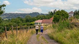 Two retirees walking along a path on the outskirts of the suburb of Idle, Bradford.