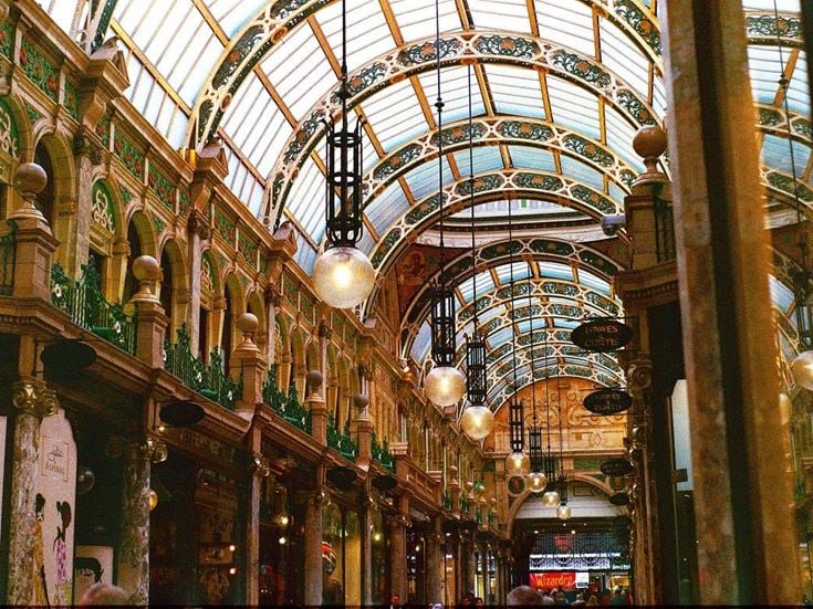 A covered market arcade in Leeds