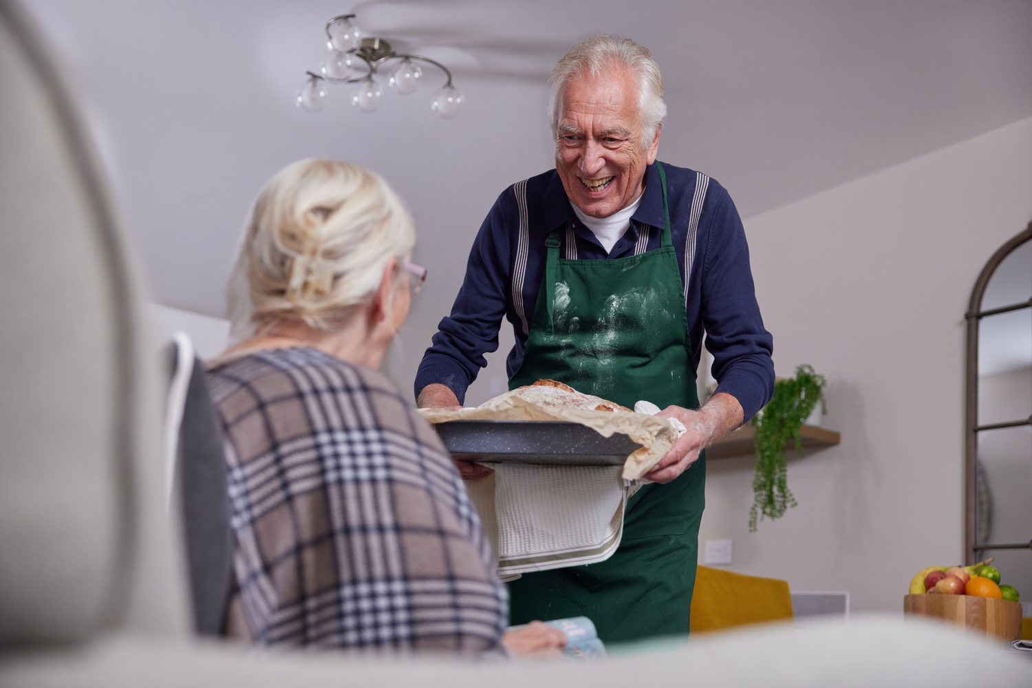 a man and a woman holding a tray of food