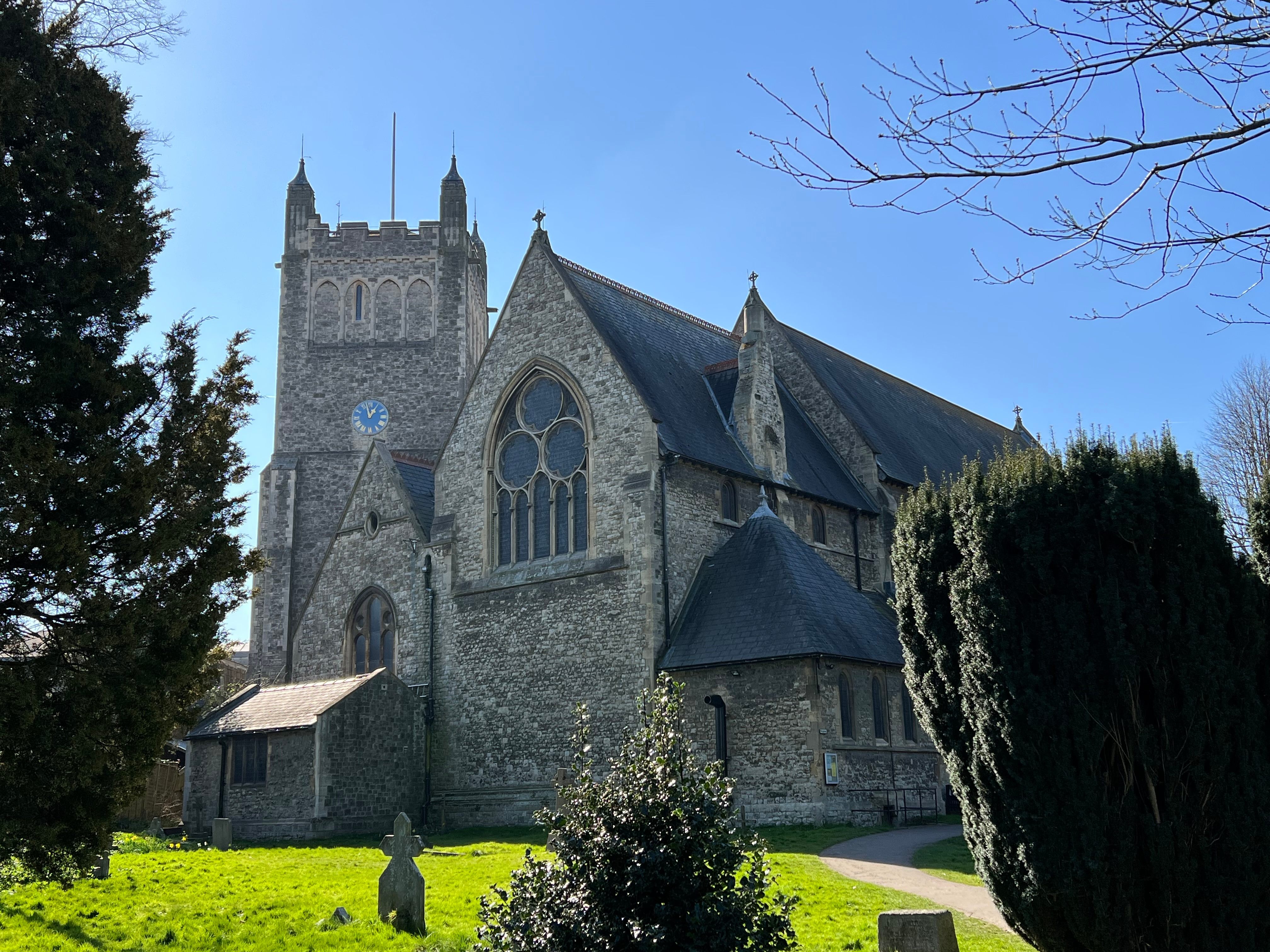 a stone church with a graveyard