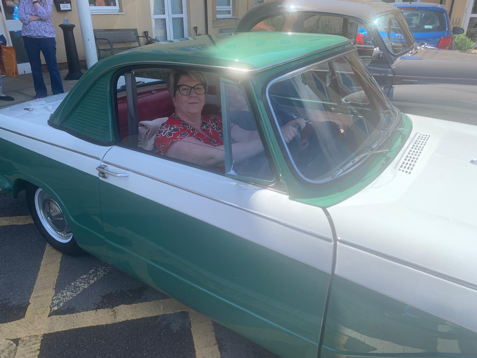 a person sitting in a car