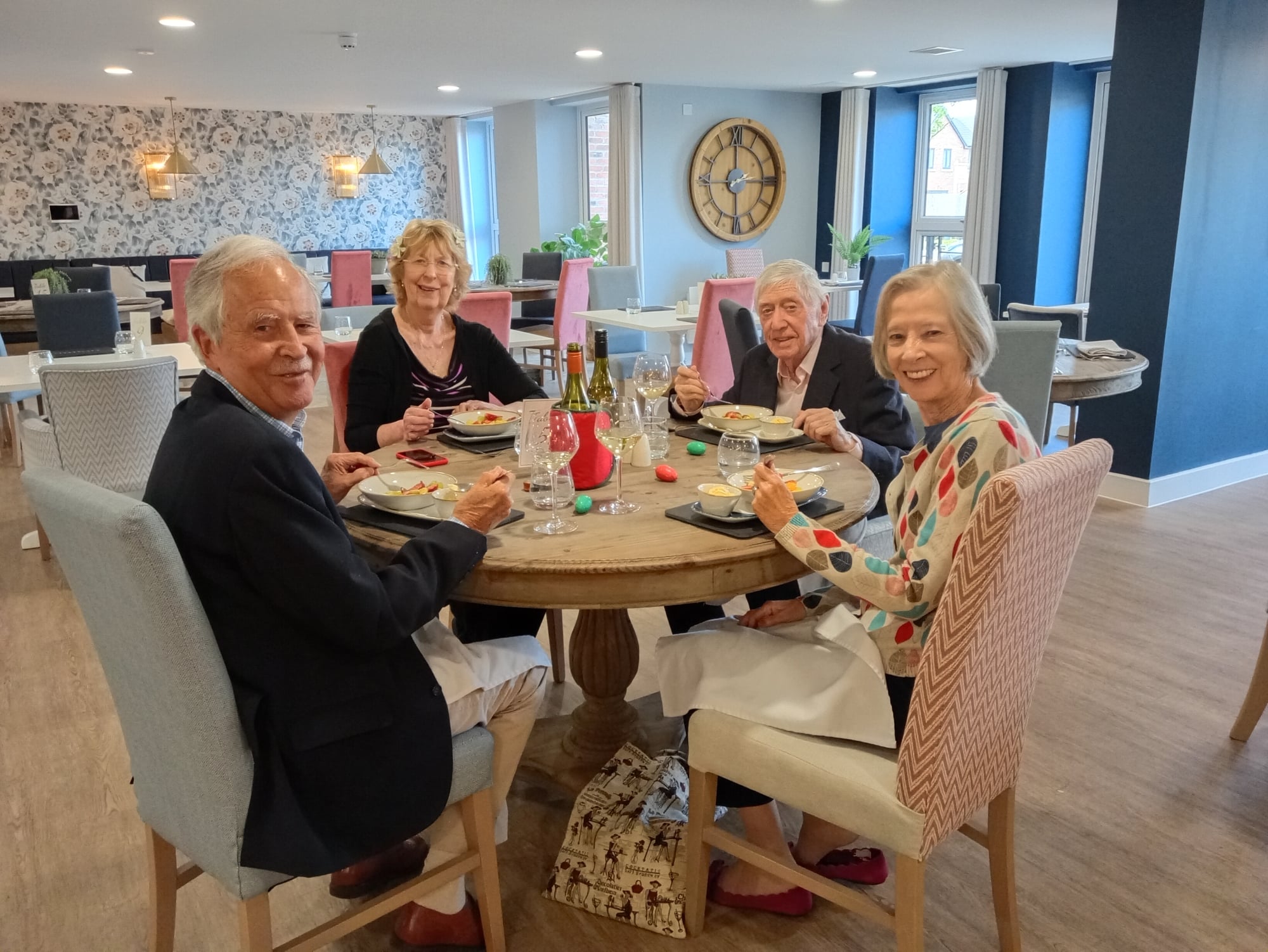 a group of people sitting around a table