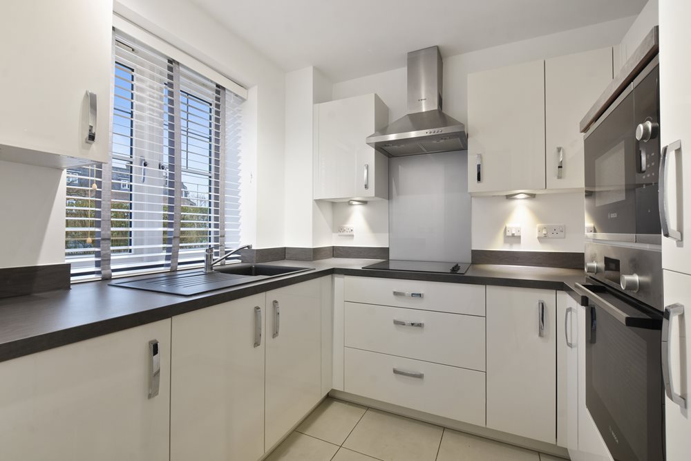 a kitchen with white cabinets