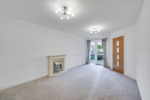 a room with a fireplace and a door