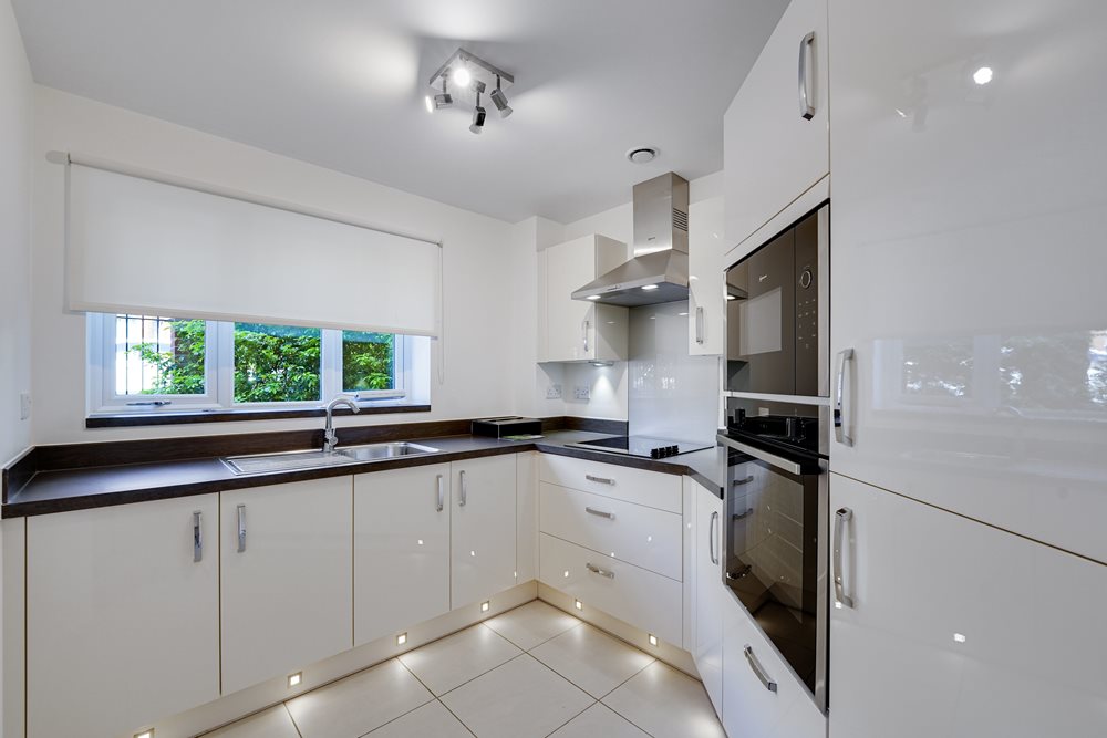 a kitchen with white cabinets
