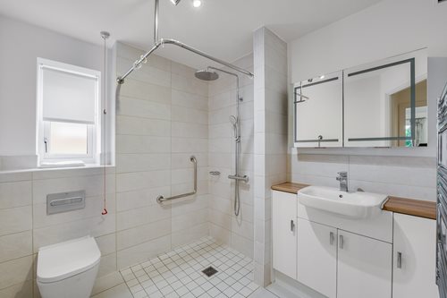 a bathroom with a shower and sink