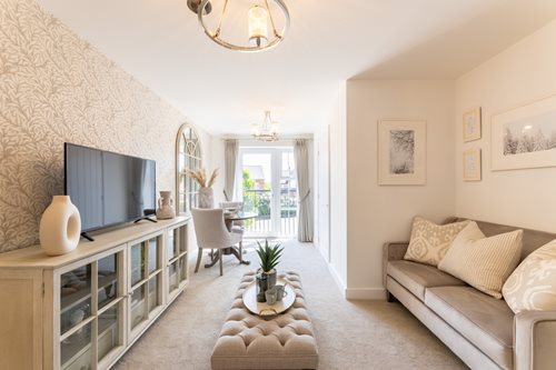 a living room with a tv and couches