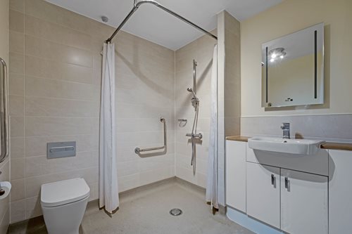 a bathroom with a shower and toilet
