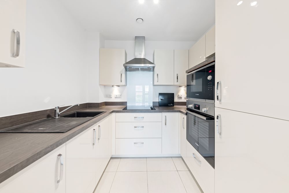 a kitchen with white cabinets