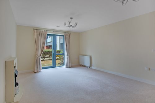 a room with a window and curtains