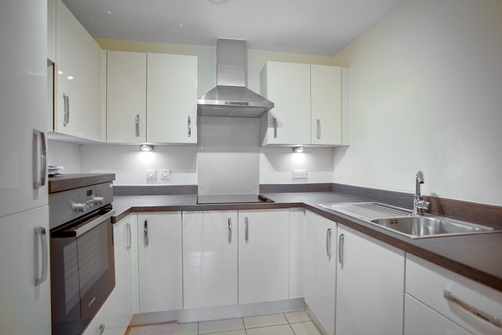 a kitchen with white cabinets