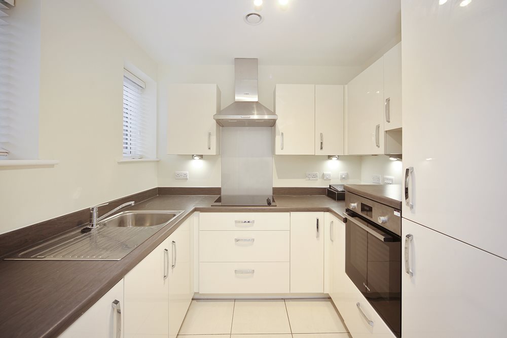 a kitchen with white cabinets