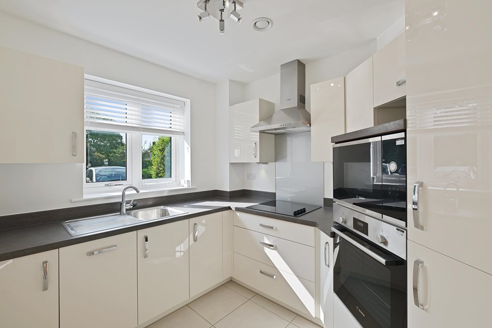 a kitchen with white cabinets